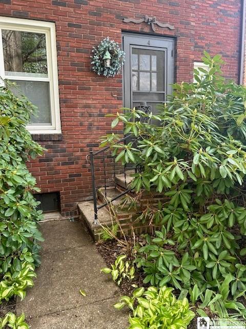4 Brewer Pl, Westfield, NY 14787 - view of exterior entry with brick siding