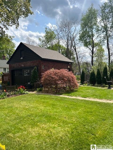 4 Brewer Pl, Westfield, NY 14787 - view of property exterior with fence, a lawn, and brick siding