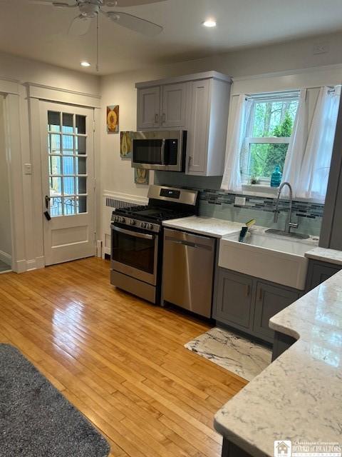 4 Brewer Pl, Westfield, NY 14787 - kitchen featuring a ceiling fan, a sink, appliances with stainless steel finishes, and gray cabinets