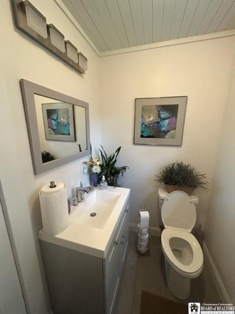 4 Brewer Pl, Westfield, NY 14787 - bathroom featuring vanity, baseboards, toilet, and wooden ceiling