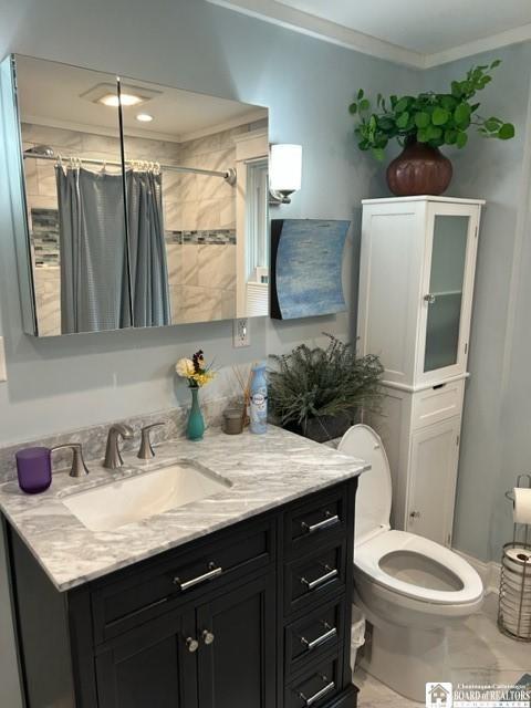 4 Brewer Pl, Westfield, NY 14787 - full bath with crown molding, toilet, a shower with curtain, and vanity