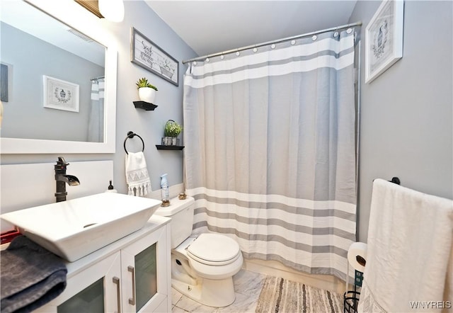 full bathroom with toilet, visible vents, marble finish floor, and vanity