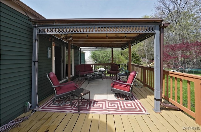 wooden deck with an outdoor living space