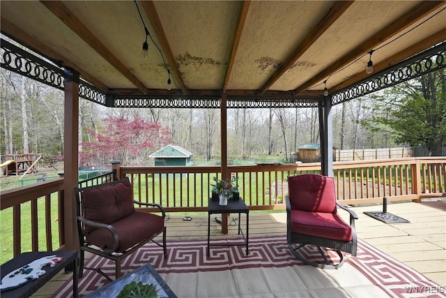 deck with fence and a yard