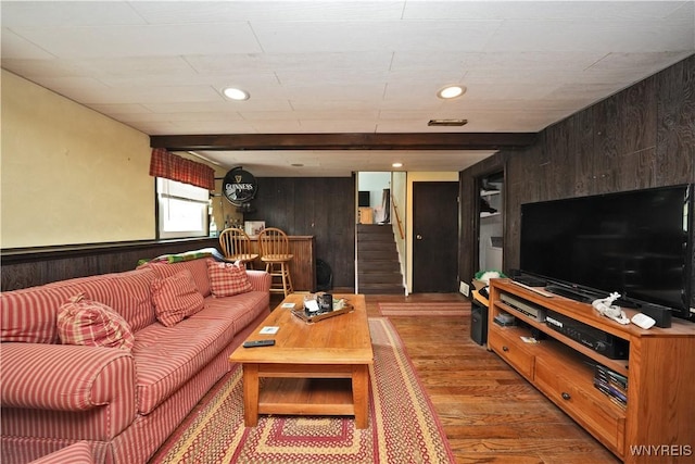 living area featuring wooden walls, recessed lighting, stairway, and light wood finished floors