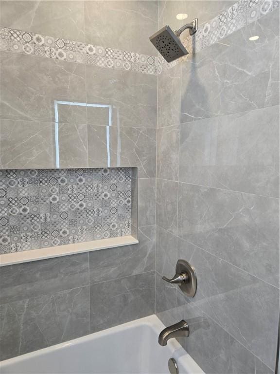 bathroom with shower / bathing tub combination