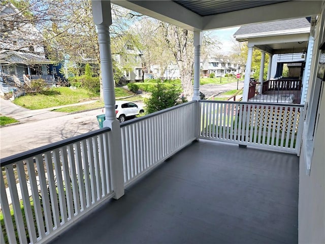 balcony with a porch and a residential view