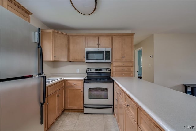kitchen with light countertops and stainless steel appliances