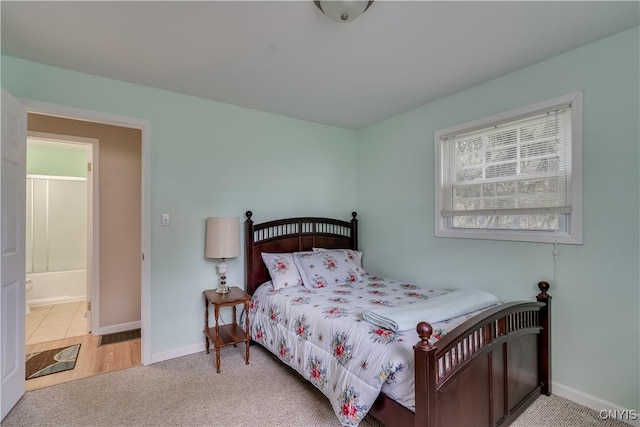 bedroom featuring carpet floors and baseboards