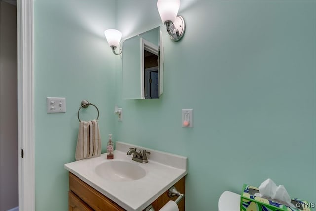 half bath with vanity and toilet