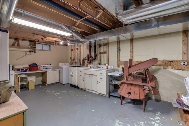 unfinished below grade area featuring separate washer and dryer
