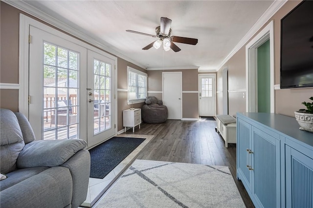 entryway featuring crown molding, a ceiling fan, dark wood-style floors, and french doors