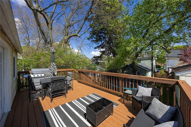 deck with outdoor dining area, an outdoor hangout area, and area for grilling