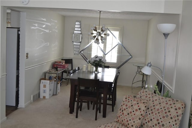 86 Everwild Ln, Greece, NY 14616 - carpeted dining space with visible vents and a chandelier