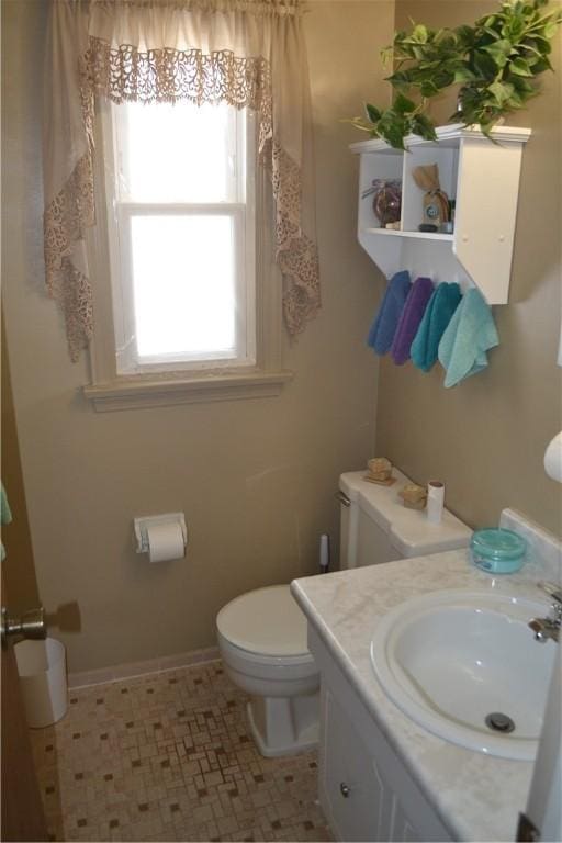 86 Everwild Ln, Greece, NY 14616 - half bathroom with vanity, baseboards, and toilet
