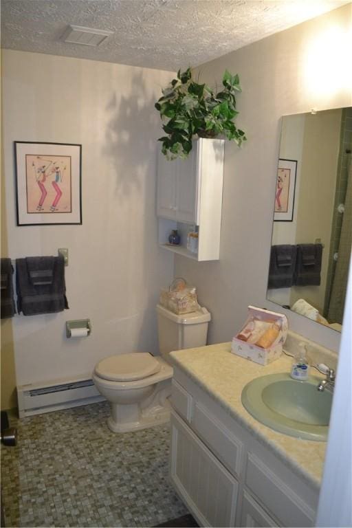 86 Everwild Ln, Greece, NY 14616 - bathroom with vanity, visible vents, toilet, baseboard heating, and tile patterned floors