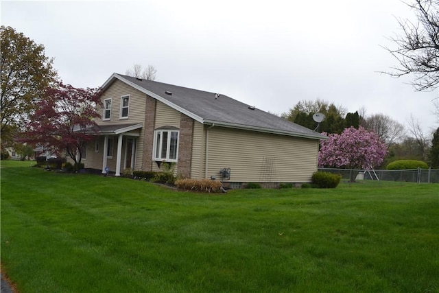 86 Everwild Ln, Greece, NY 14616 - view of property exterior featuring a lawn and fence