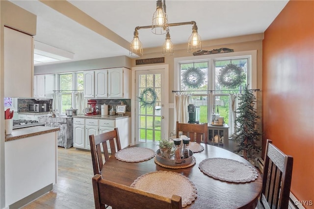 dining area with light wood-type flooring