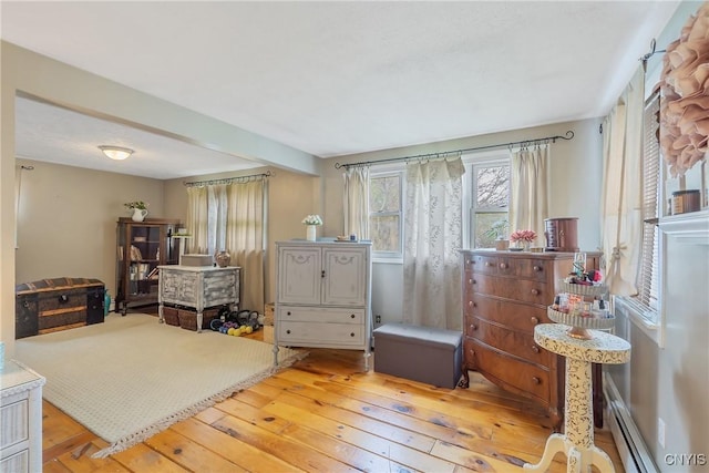 interior space with a baseboard radiator and light wood-type flooring