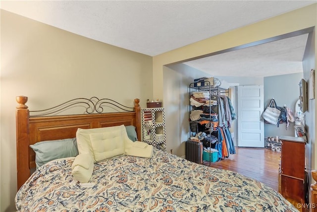 bedroom featuring wood finished floors