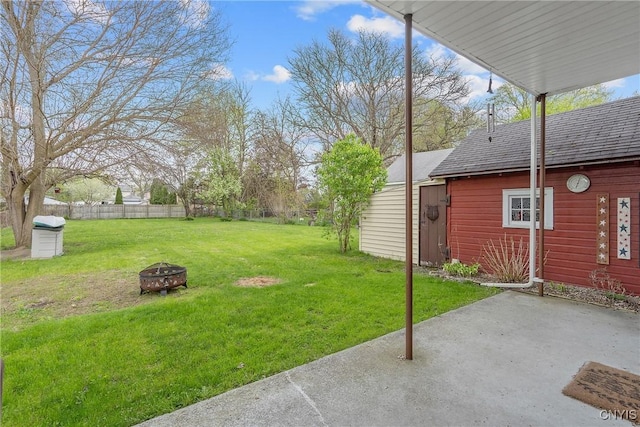view of yard featuring a fire pit, fence private yard, and a patio area