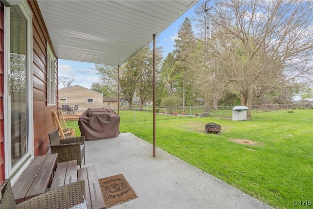 view of patio with a fenced backyard and an outdoor fire pit