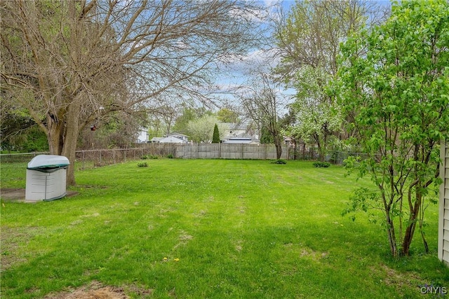 view of yard with a fenced backyard