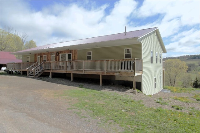 200 Mertz Rd, Bainbridge, NY 13733 - rear view of house with metal roof and a wooden deck