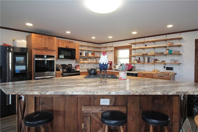 200 Mertz Rd, Bainbridge, NY 13733 - kitchen featuring crown molding, open shelves, recessed lighting, a kitchen bar, and black appliances