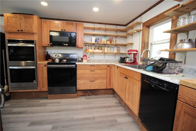 200 Mertz Rd, Bainbridge, NY 13733 - kitchen with open shelves, light wood-type flooring, recessed lighting, light countertops, and black appliances