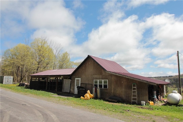 200 Mertz Rd, Bainbridge, NY 13733 - view of side of home with an outbuilding, an exterior structure, and metal roof