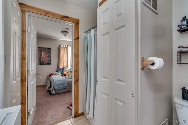 25082 Ridge Rd, Watertown-Town, NY 13601 - hall with light colored carpet, baseboards, light tile patterned floors, and visible vents