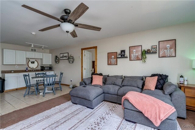 25082 Ridge Rd, Watertown-Town, NY 13601 - living area with visible vents, a ceiling fan, light tile patterned floors, and track lighting