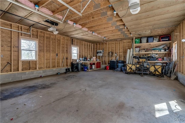 25082 Ridge Rd, Watertown-Town, NY 13601 - garage featuring a workshop area