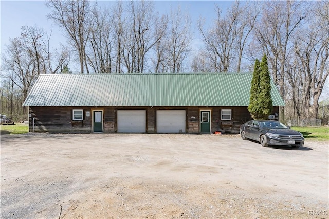 25082 Ridge Rd, Watertown-Town, NY 13601 - view of outbuilding with an attached garage and dirt driveway