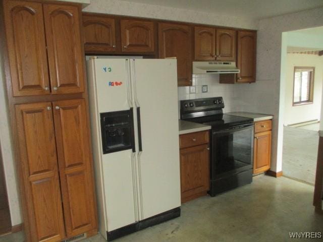 kitchen featuring light countertops, under cabinet range hood, brown cabinets, black electric range, and white fridge with ice dispenser