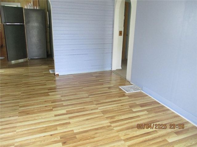 26 Balcom Ave, Corning, NY 14830 - spare room with arched walkways and light wood-style floors