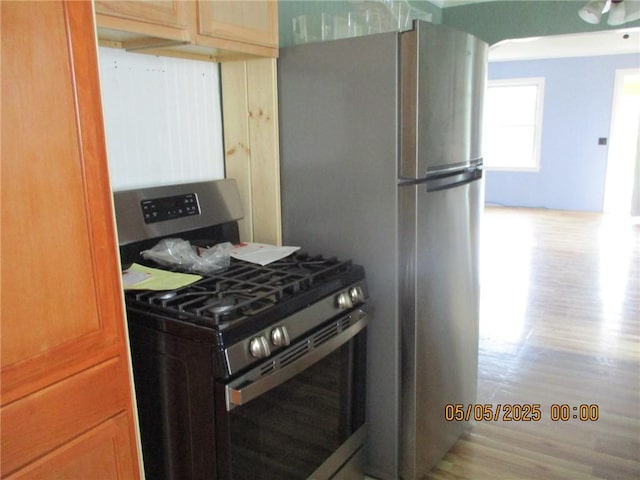 26 Balcom Ave, Corning, NY 14830 - kitchen with appliances with stainless steel finishes and wood finished floors