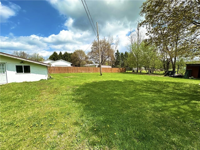 view of yard with fence