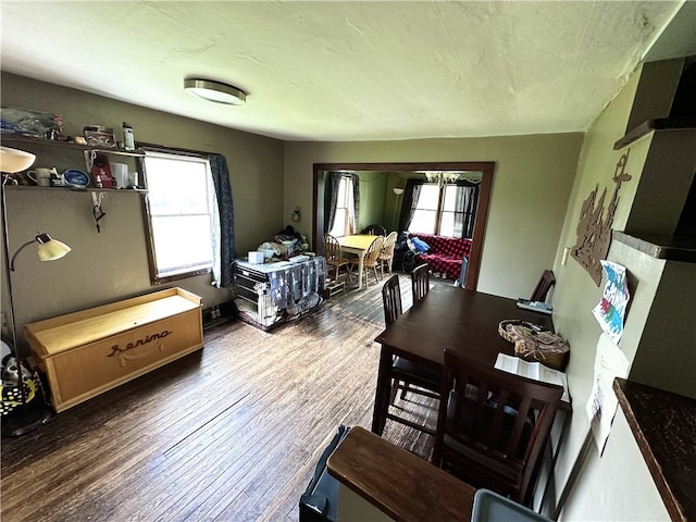 dining space with wood finished floors