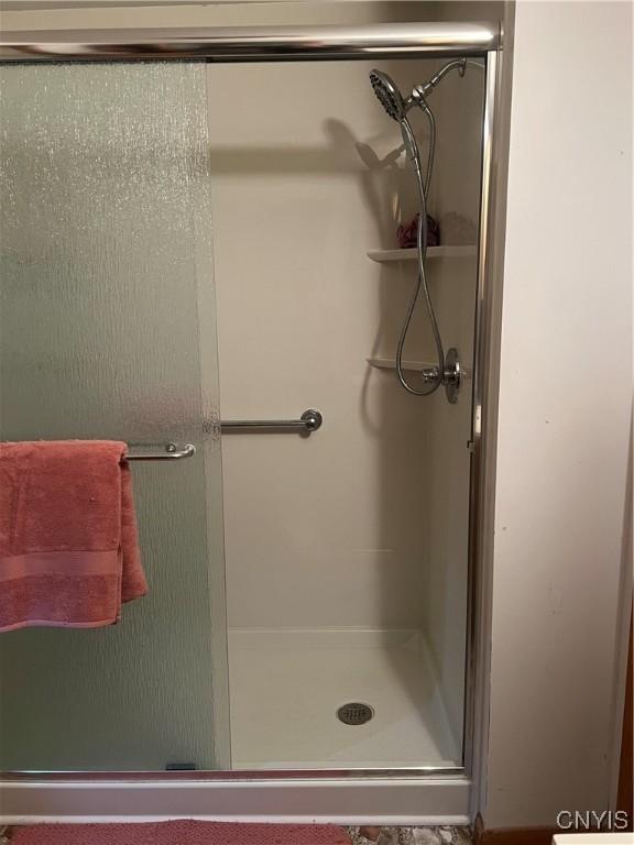 full bathroom with a shower stall