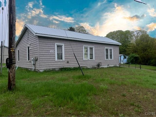 back of property with a yard