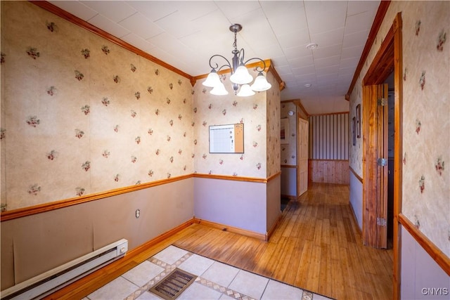 11511 State Route 26, Ava, NY 13303 - unfurnished dining area featuring an inviting chandelier, wallpapered walls, a baseboard heating unit, and light wood-type flooring