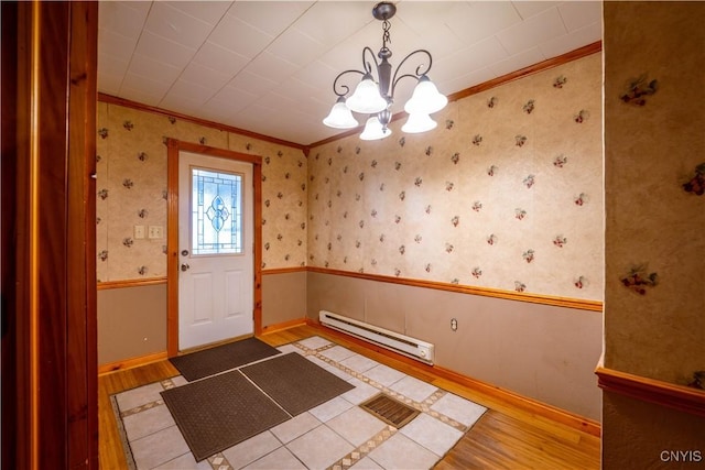 11511 State Route 26, Ava, NY 13303 - entrance foyer featuring light wood-style floors, ornamental molding, a chandelier, and baseboard heating