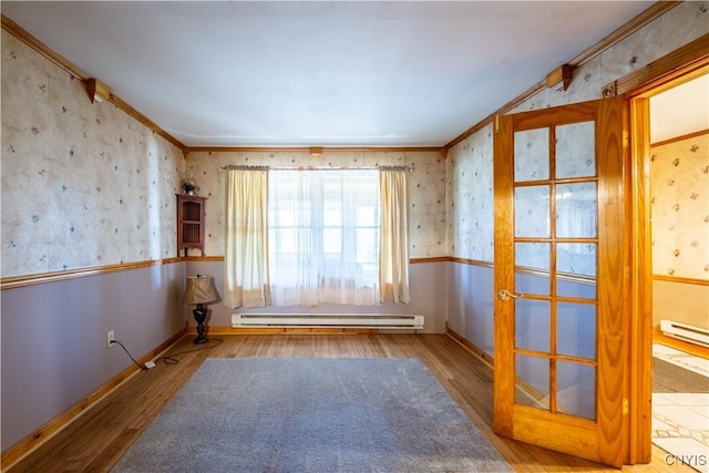 11511 State Route 26, Ava, NY 13303 - empty room with wallpapered walls, ornamental molding, wood finished floors, and a baseboard radiator