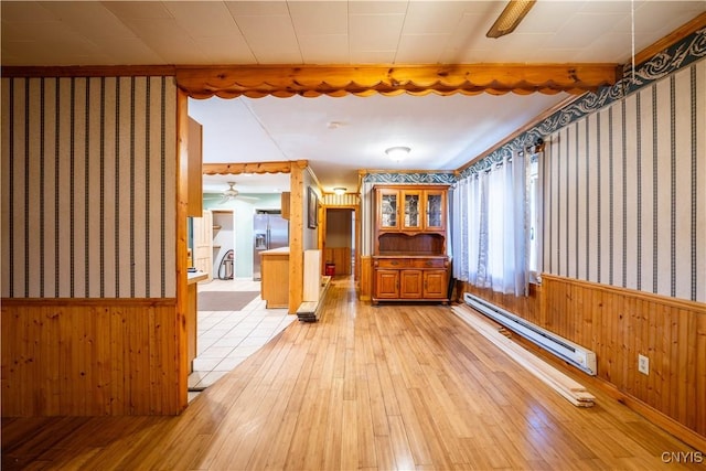 11511 State Route 26, Ava, NY 13303 - unfurnished room featuring light wood-style floors, a wainscoted wall, and baseboard heating