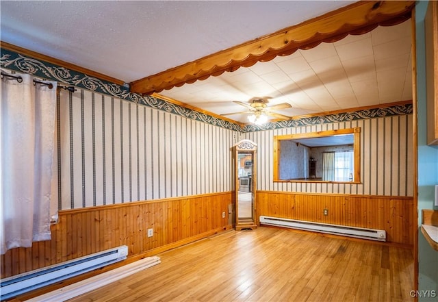 11511 State Route 26, Ava, NY 13303 - spare room with a wainscoted wall, baseboard heating, and hardwood / wood-style floors