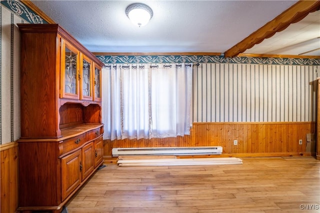 11511 State Route 26, Ava, NY 13303 - interior space with wooden walls, wallpapered walls, a baseboard heating unit, and light wood-style flooring
