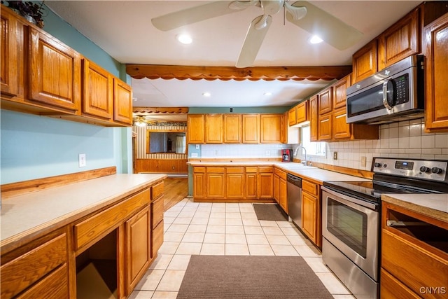 11511 State Route 26, Ava, NY 13303 - kitchen featuring light tile patterned floors, appliances with stainless steel finishes, ceiling fan, and tasteful backsplash