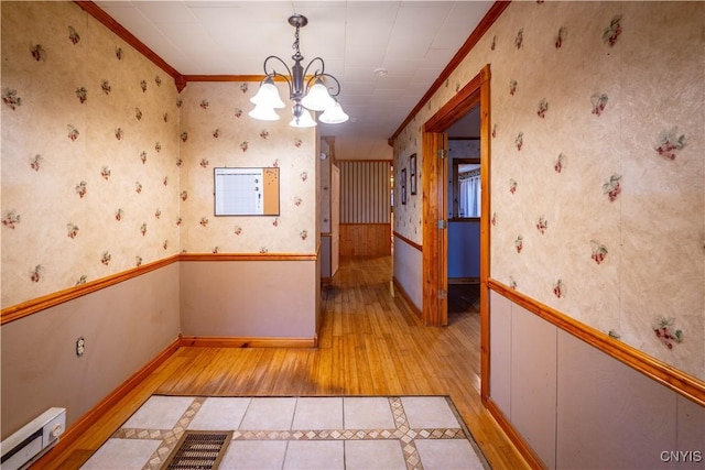 11511 State Route 26, Ava, NY 13303 - interior space with crown molding, wallpapered walls, a baseboard radiator, light wood finished floors, and a notable chandelier